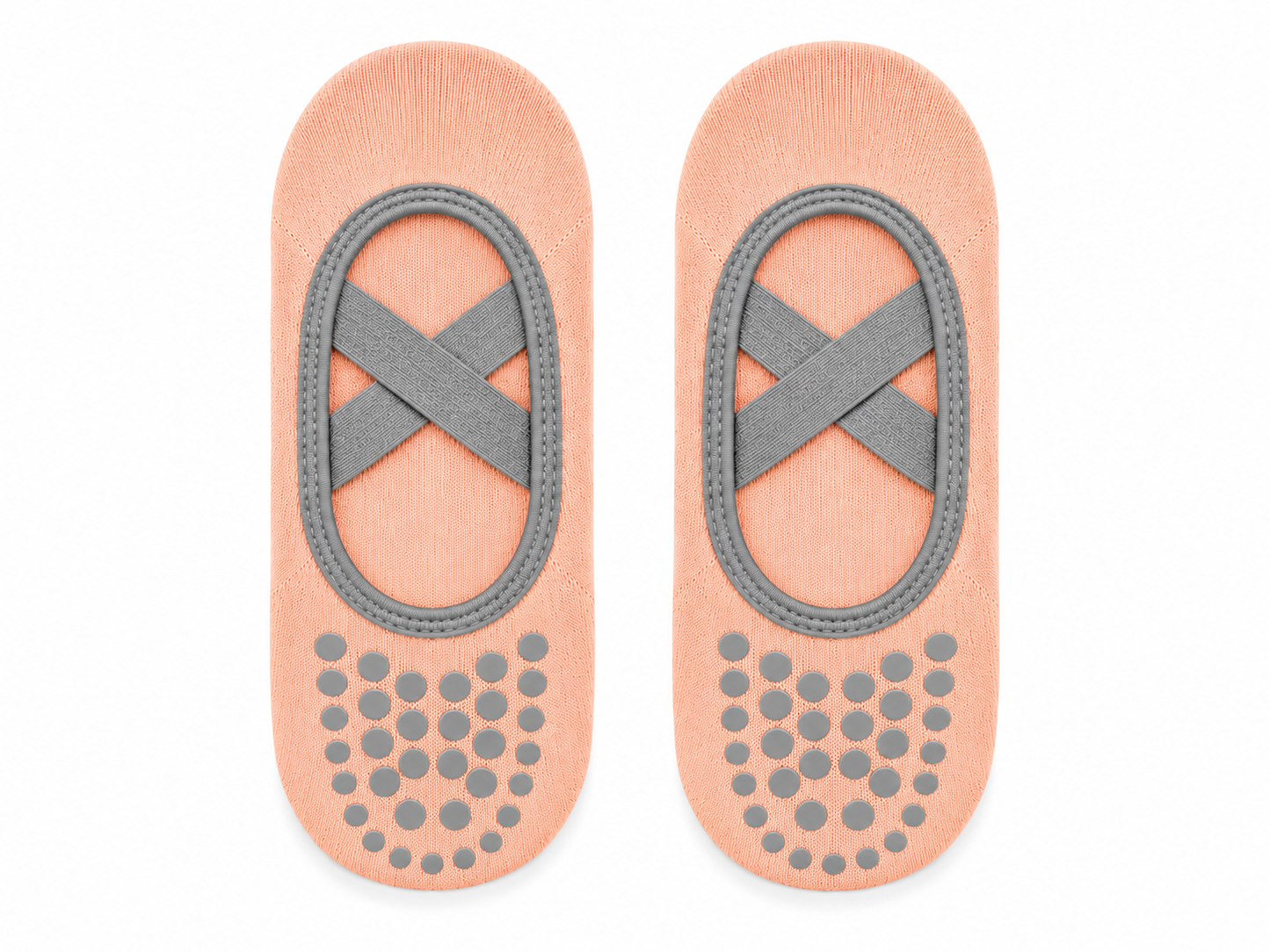 Pair of peach-colored foot pads with gray straps and textured sole on a white background