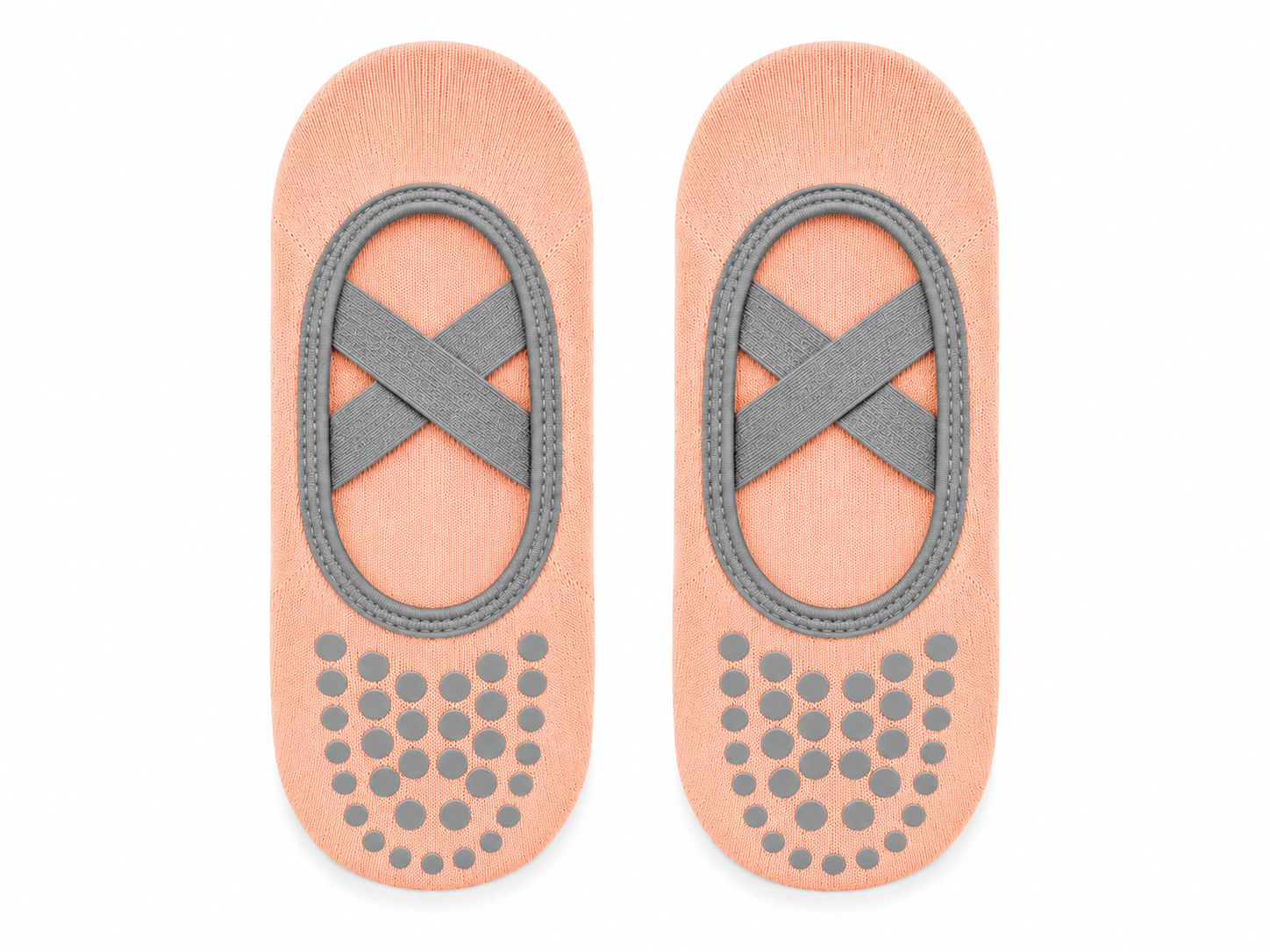 Pair of peach-colored foot pads with gray straps and textured sole on a white background
